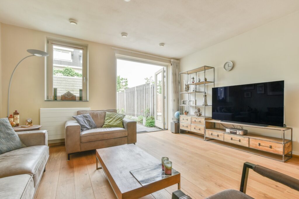 Living room with stylish furniture and lamp